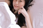 白嫩性感床上美女藝術寫真照片
