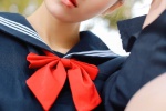 Seductive photo of college style beauty in navy uniform