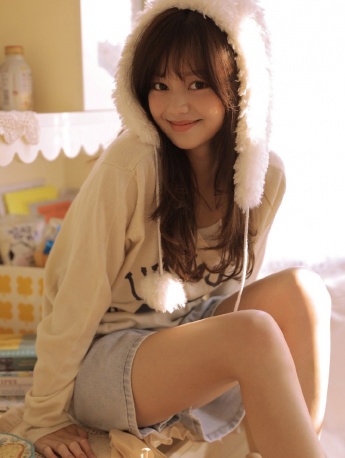 Sexy photo of beautiful woman with sweet smile and long legs