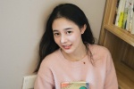 Shy and sweet photo of a beautiful student girl in the study room