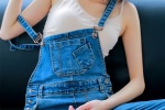 Bold vacuum temptation photo of beauty in overalls