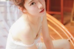 Seductive photo of beautiful lady in white silk stockings with sexy legs
