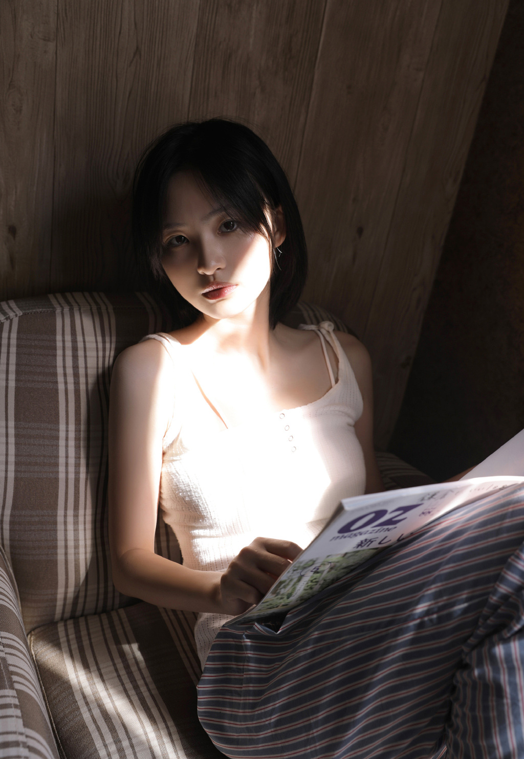 Beautiful girl in a tank top, refreshing and healing at home photo