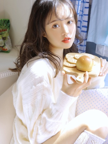 Sexy photo of a beautiful girl with beautiful legs in white stockings