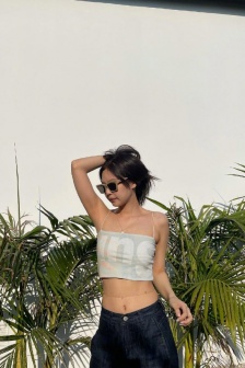 Sexy photo of JENNIE wearing sunglasses and touching breasts