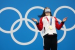 Chinese Canadian swimmer wins 100m butterfly