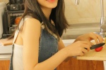 Beautiful girl with bright smile seductive kitchen photo