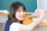 Sweet photo of a delicate and pure beauty student girl in the classroom