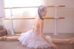 Elegant and sexy photo of beautiful woman with bare back dancing gauze skirt