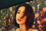 Wu Jinyan's retro curly hair fashion sexy photo