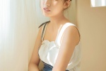 Sexy photo of a beautiful girl with round head and exposed shoulders
