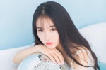 Temperamental long-haired beauty wet and seductive photo in bathtub