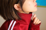 Sexy classroom photo of short-haired beauty in red sportswear