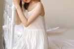 Charming and seductive photo of beautiful woman in suspender nightgown