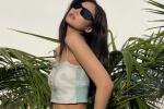 Sexy photo of JENNIE wearing sunglasses and touching breasts