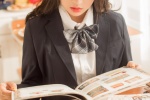Seductive photo of beautiful school girl at desk in JK uniform