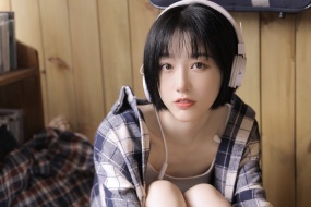 Beautiful girl wearing headphones photo wallpaper