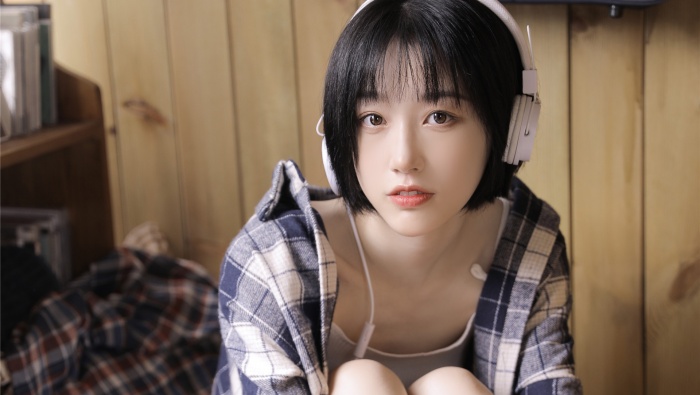 Beautiful girl wearing headphones photo wallpaper