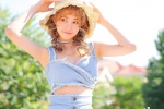Summer outdoor photos of beauties in straw hats and low-cut legs
