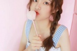 Photo of playful ponytail beauty in sexy suspender skirt