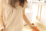 Seductive photo of sexy kitchen beauty with voluptuous legs