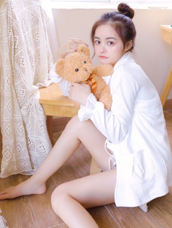 Lazy and sexy photo of long-legged beauty in white shirt