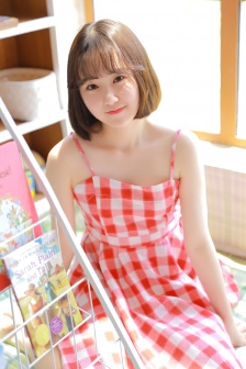 Charming and sexy photo of fair and tender beauty in beautiful suspender skirt