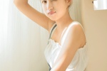 Sexy photo of a beautiful girl with round head and exposed shoulders