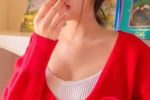 Photo of sexy pretty girl in red cardigan and low-cut suspender belt