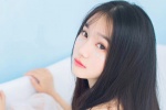 Temperamental long-haired beauty wet and seductive photo in bathtub