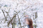 Beautiful girl outdoor photography photo under cherry blossom tree