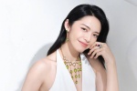 Yao Chen's charming and sexy photo in white deep V dress