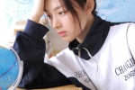 Seductive photo of beauty in school uniform, classroom desk, uniform