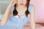 Photo of playful ponytail beauty in sexy suspender skirt