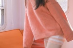 Beautiful girl in pink sweater mobile wallpaper