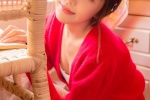 Photo of sexy pretty girl in red cardigan and low-cut suspender belt