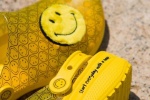 Crocs joint smiley face shoes displayed from multiple angles