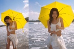 Fresh and sexy photo of a seaside beauty showing off her waist