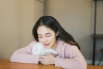 Shy and sweet photo of a beautiful student girl in the study room