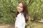 Beautiful girl in amusement park, sexy girl in miniskirt and uniform