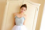 Beautiful and moving photo of dance teacher in suspender gauze skirt