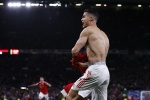 Cristiano Ronaldo strips off and shows off his muscles to celebrate after scoring a goal, very clear and beautiful pictures