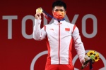 Li Fabin wins gold medal in men's 61kg weightlifting class