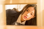 Seductive photo of beautiful school girl at desk in JK uniform