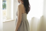 Charming photo of beautiful woman in backless suspender skirt