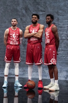 Former Timberwolves player LaVine Wiggins-Towns poses for photo before game