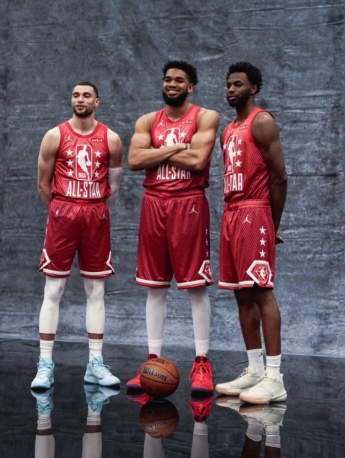 Former Timberwolves player LaVine Wiggins-Towns poses for photo before game