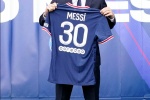Messi shows off Paris team's new jersey photos