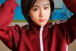 Sexy classroom photo of short-haired beauty in red sportswear
