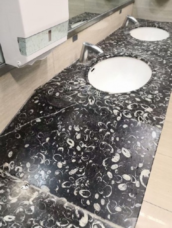 Detailed view of the fossil sink in Guiyang Airport toilet